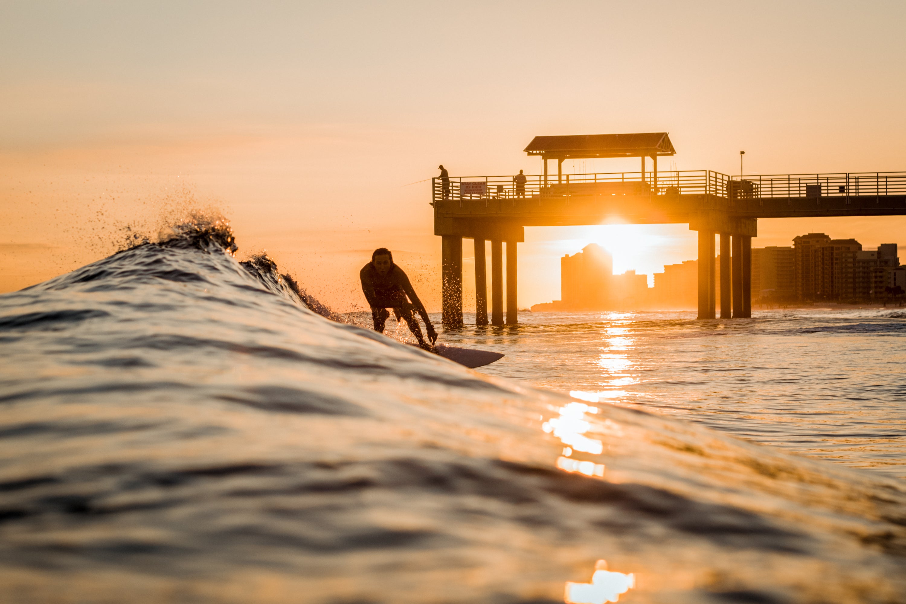 Sam Sumlin placed 3rd in the Nature-Based Activities category of the 2020 Outdoor Alabama Photo Contest with his image of a surfer (Grant Hesse) at Orange Beach, Alabama.