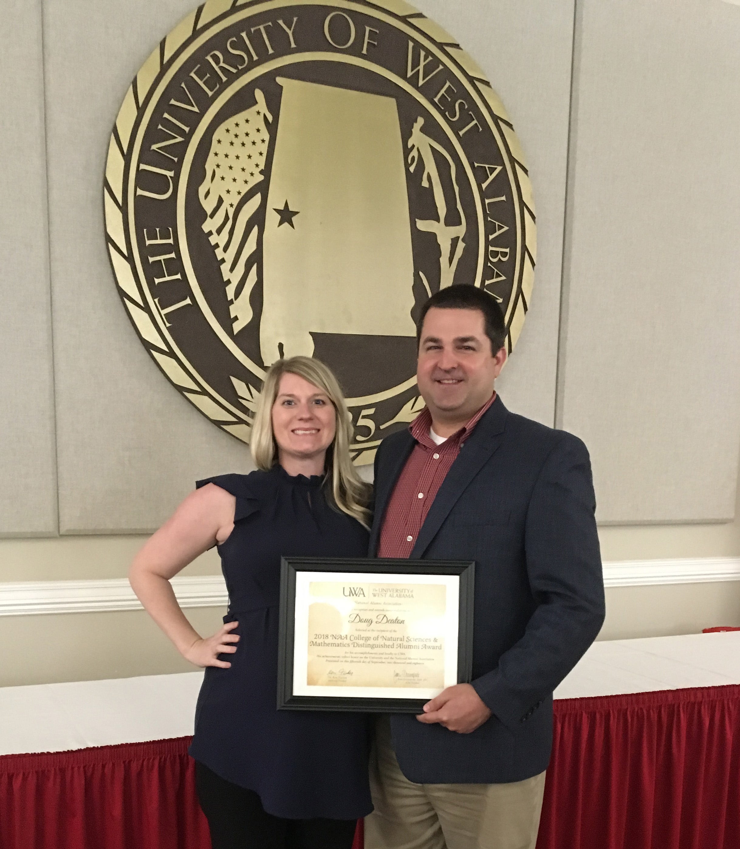 Doug Deaton with his wife Jenna after receiving the 2018 Distinguished Alumni Achievement