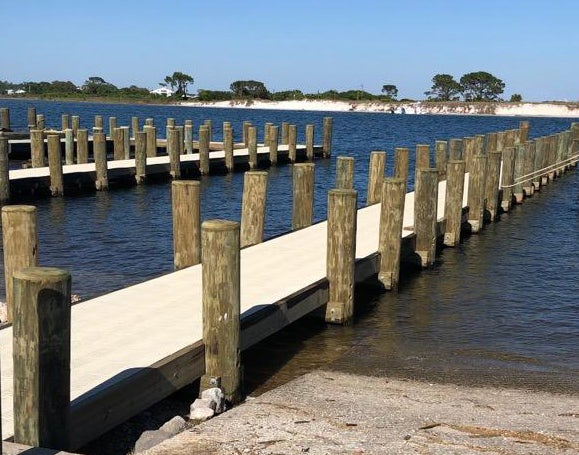 Completed renovations include the replacement of all piers with new piles, new decking with composite nonslip material and the repair of paver depressions. The parking spaces were also restriped.