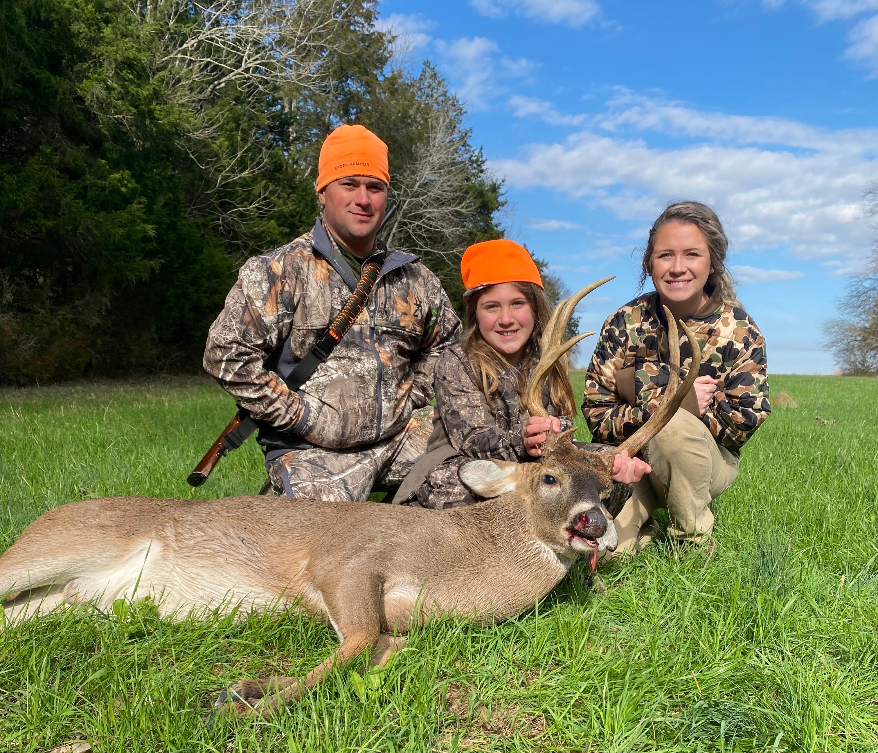 Nick Anderson, his daughter Presley, and Brae Buckner with ADCNR’s State Lands Division after a successful youth deer hunt at the M. Barnett Lawley Forever Wild Field Trial Area in Hale County.