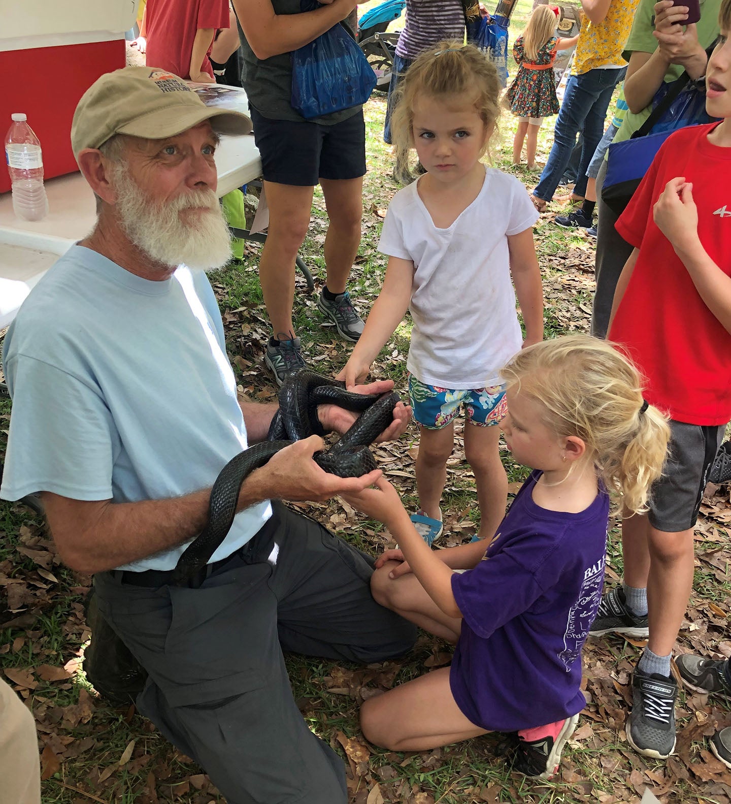 Jim Godwin with the Auburn University Natural Heritage Program teaches festival goers about the Eastern indigo snake. 