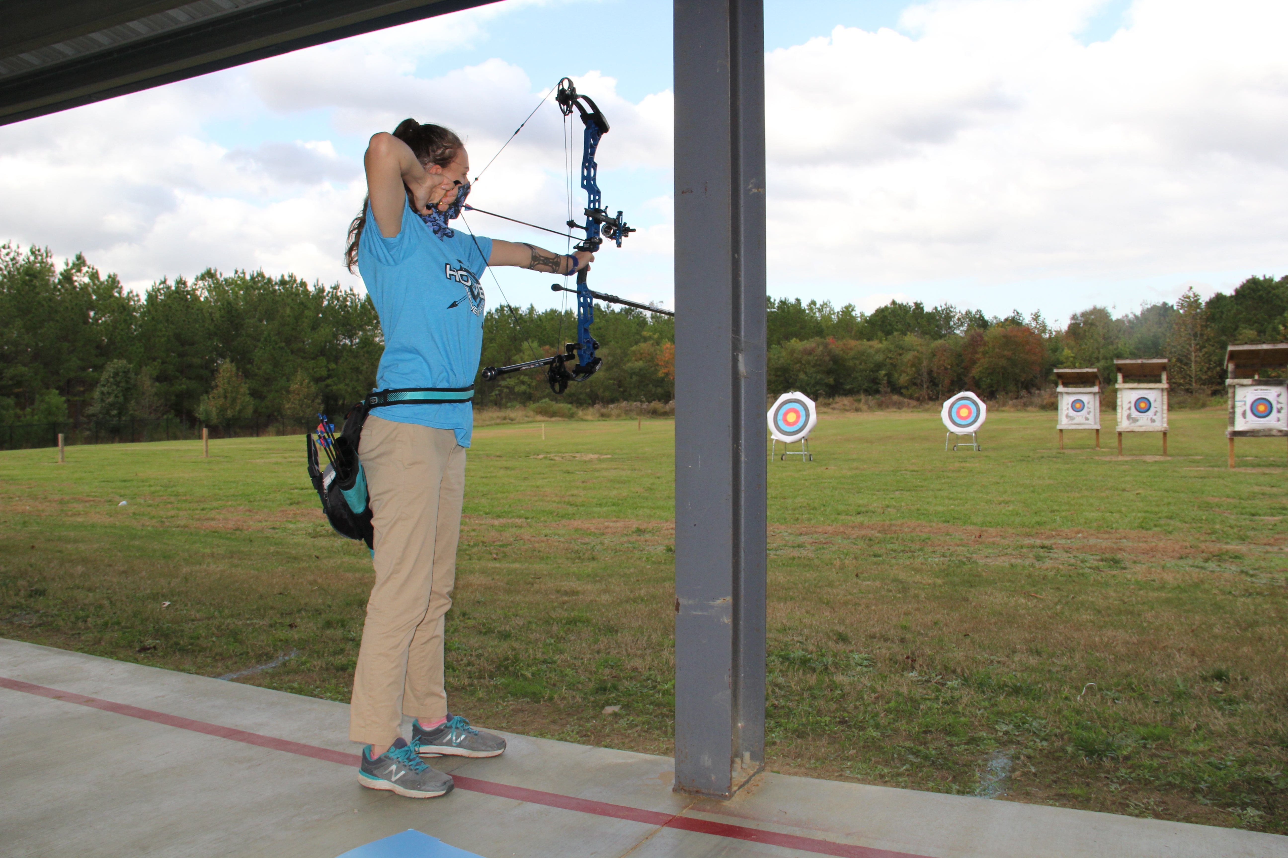 Veronica Walker, an eighth-grader at Saint Francis Xavier Catholic School in Birmingham, draws her bow during a recent ribbon cutting ceremony for the new Hoover Community Archery Park.