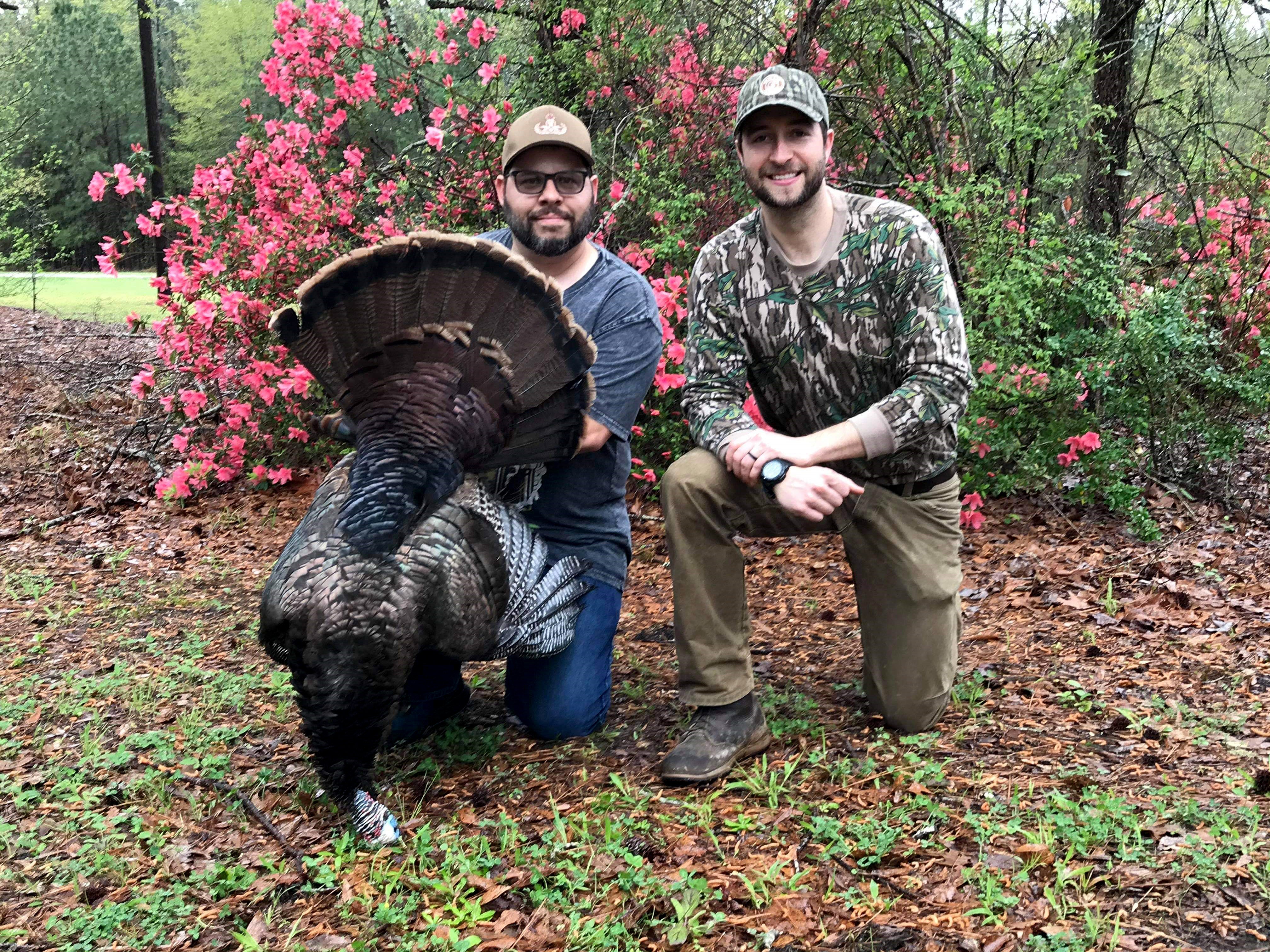 Jessie Barcala (left) harvested his first wild turkey with guidance from ADCNR hunting mentor Justin Grider (right).