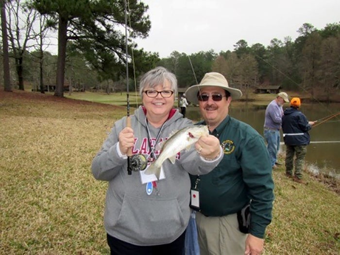 Julie Bolin from Brookwood, Alabama, learned the art of fly fishing from ADCNR Aquatic Education Coordinator Doug Darr during Alabama's Becoming an Outdoors-Woman workshop in 2018.