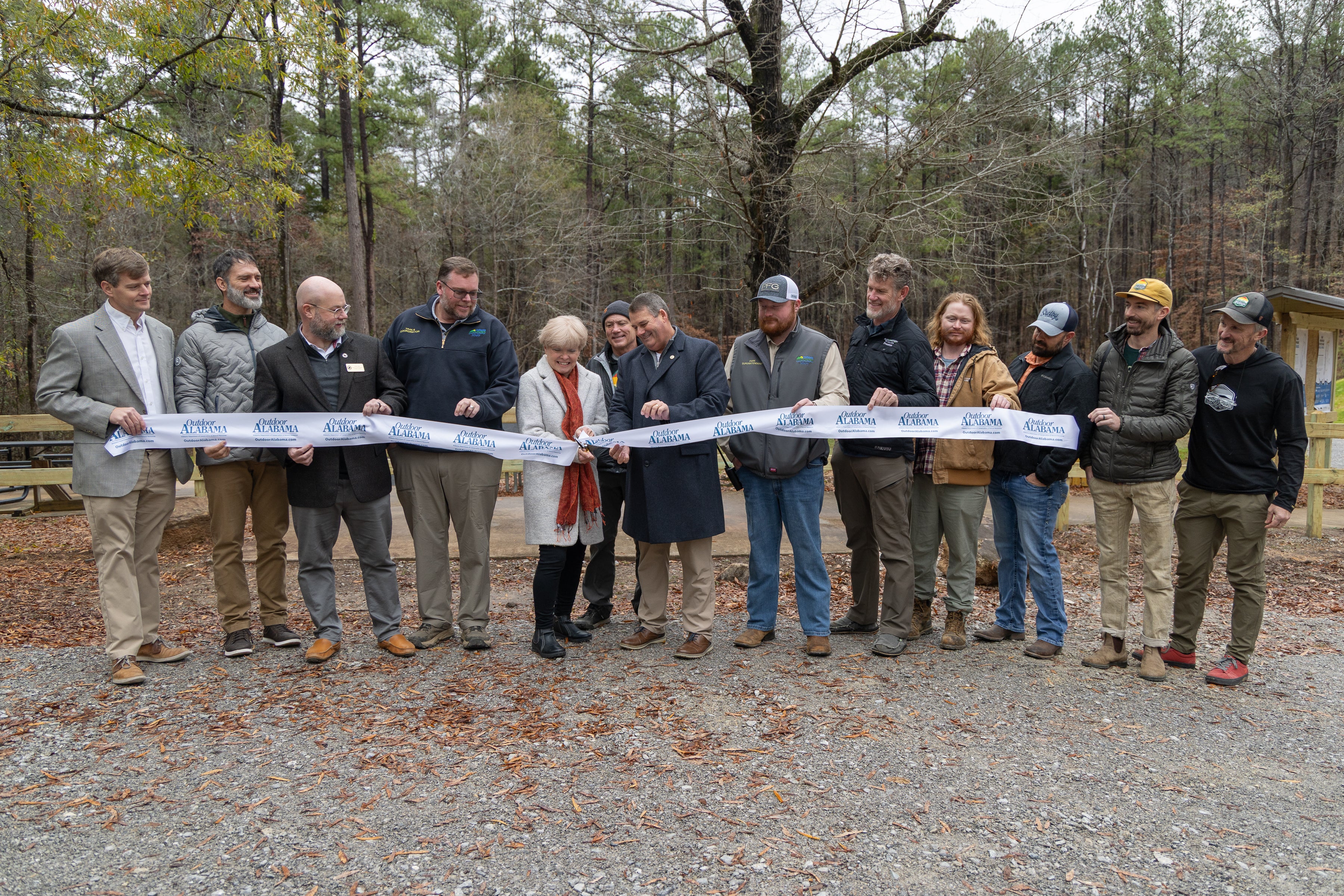 State and local officials cut the ribbon on the new pump track at Oak Mountain State Park